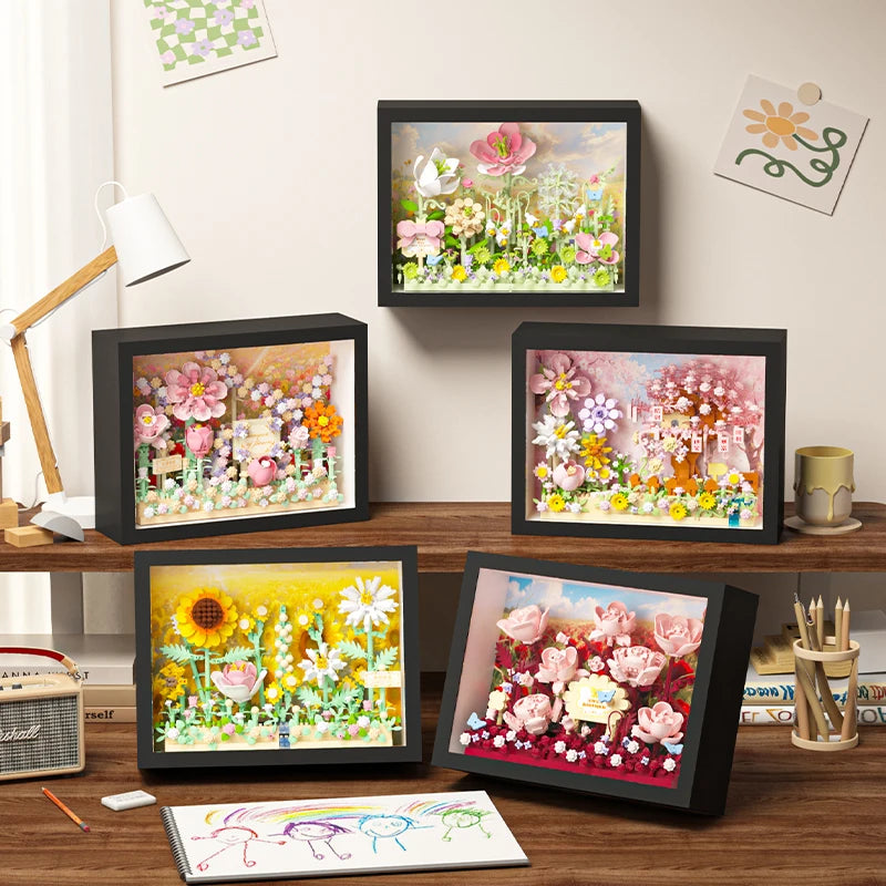 A set of 3D flower building blocks displayed on a framed board for a DIY craft kit.
