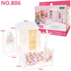 A pink dollhouse bedroom set featuring a crib, mirror, and stuffed animals for a 1:12 scale dollhouse.