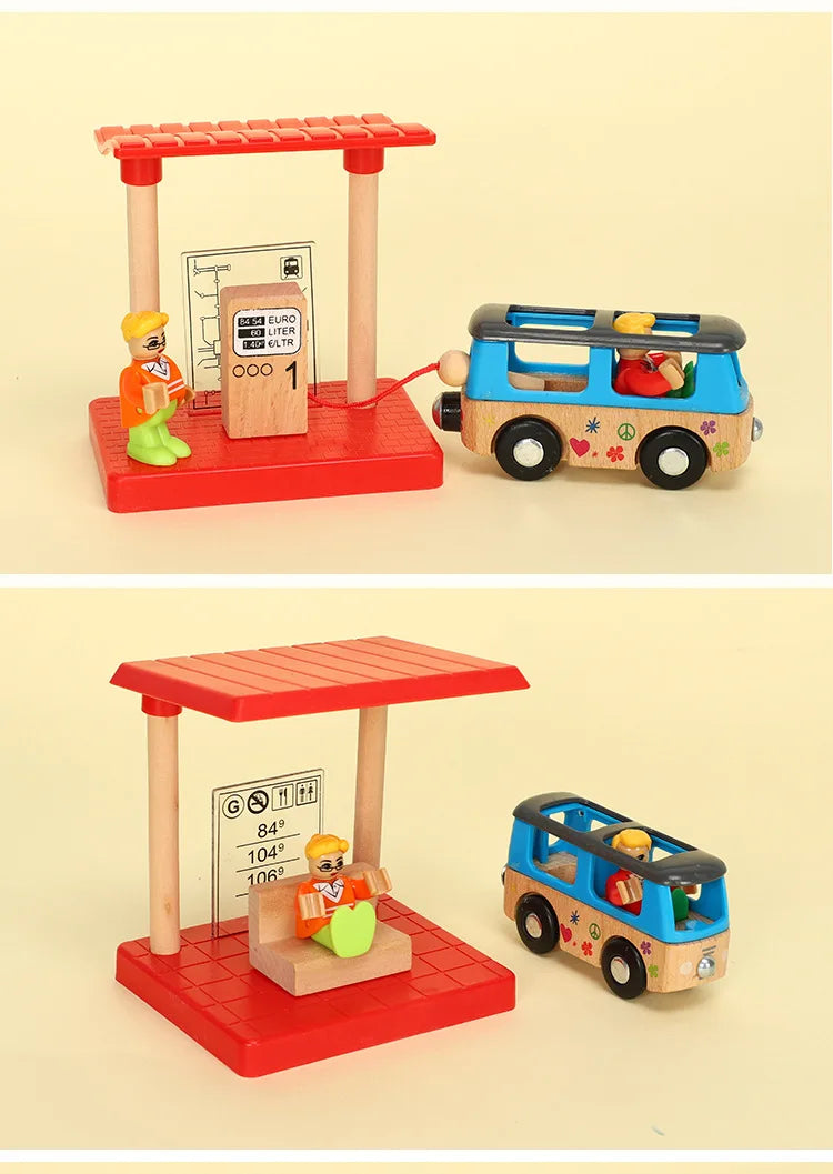 A wooden train track accessory set featuring a red and pink station and a blue and yellow wooden train.