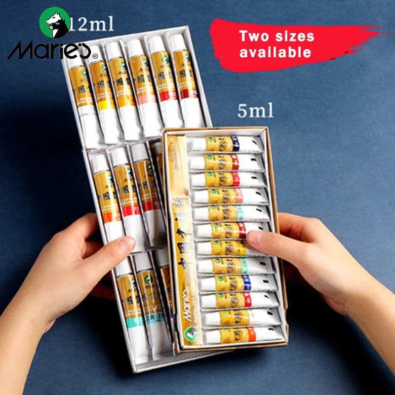 A hand holds a box of Marie's Chinese painting pigments with two sizes available, showing multiple small tubes.