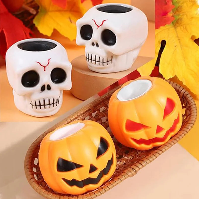 A set of Halloween sensory toys featuring orange pumpkin and white skull squeeze stress balls.