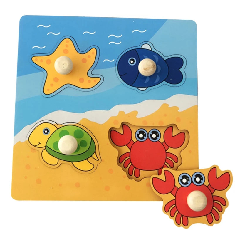 A set of wooden puzzles featuring sea creatures like a fish, turtle, and crab for toddlers.