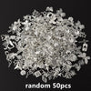 A pile of random silver and gold metal charms for DIY jewelry making
