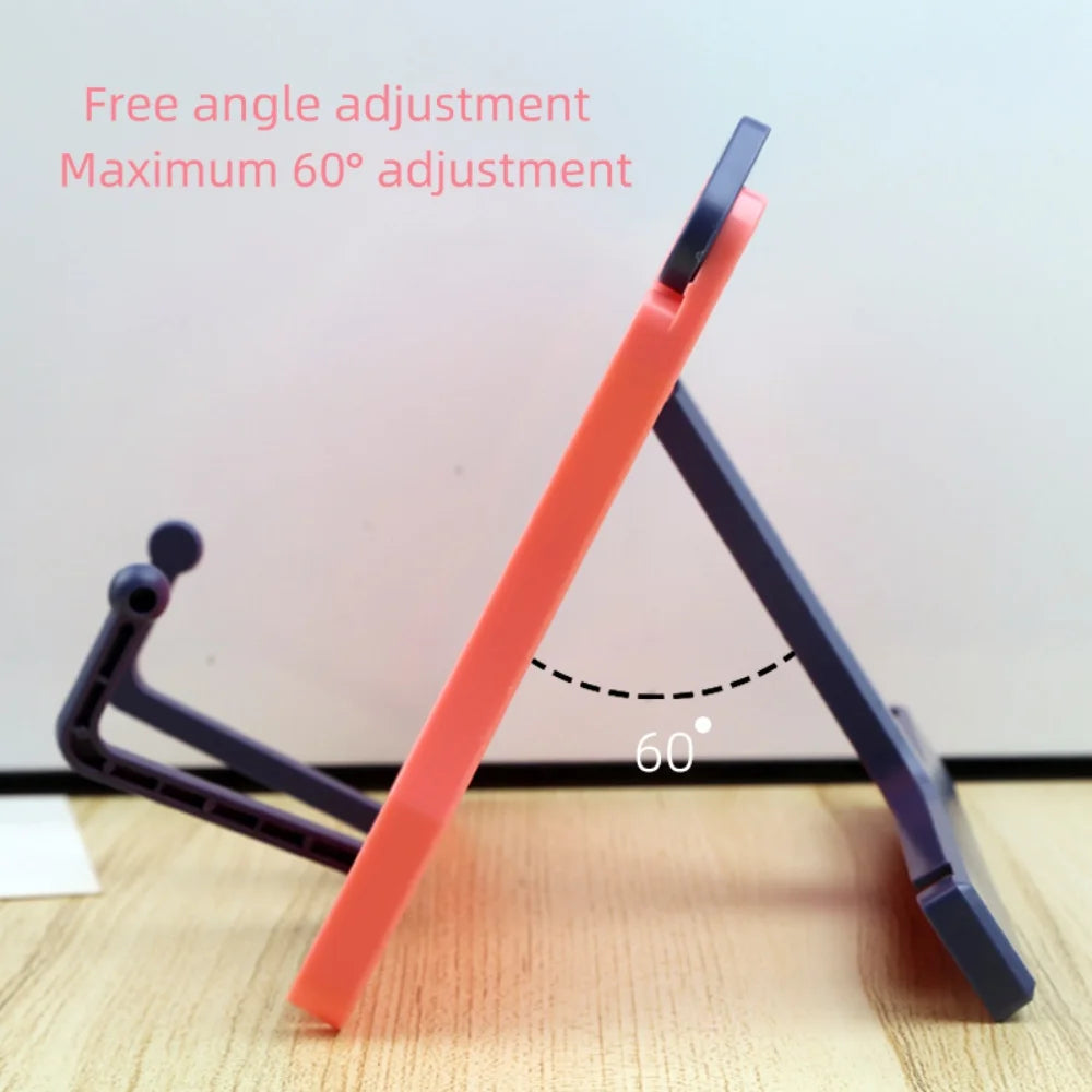 An orange adjustable portable book stand is shown at a 60-degree angle against a white background.