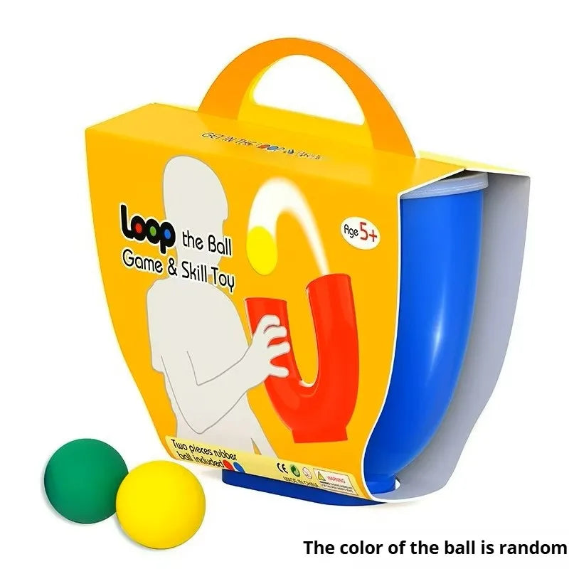 An orange box for a U-shaped juggling ball skill toy with green and yellow balls.
