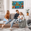 A family of three is sitting on a sofa in a living room, looking at a framed jigsaw puzzle of an ocean giant turtle.