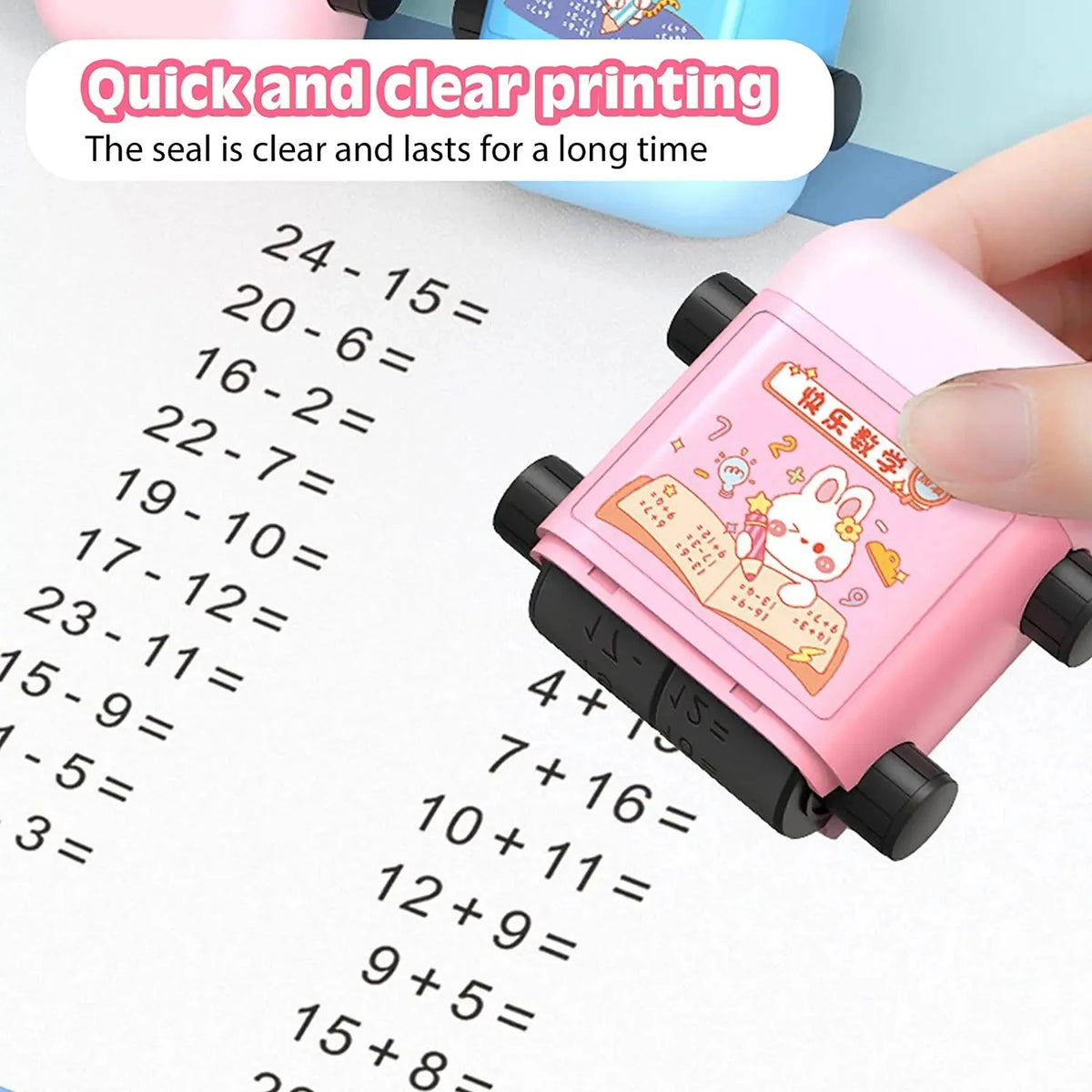 A pink roller stamp used for clear and lasting printing of multiplication and division math problems on paper.