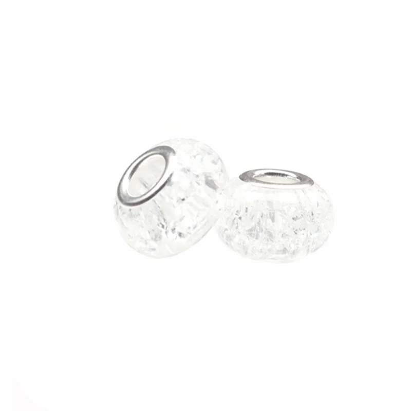 A pair of clear, faceted resin spacer beads for DIY jewelry making.