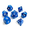 A collection of blue metal polyhedral dice showing various numbers and angles.