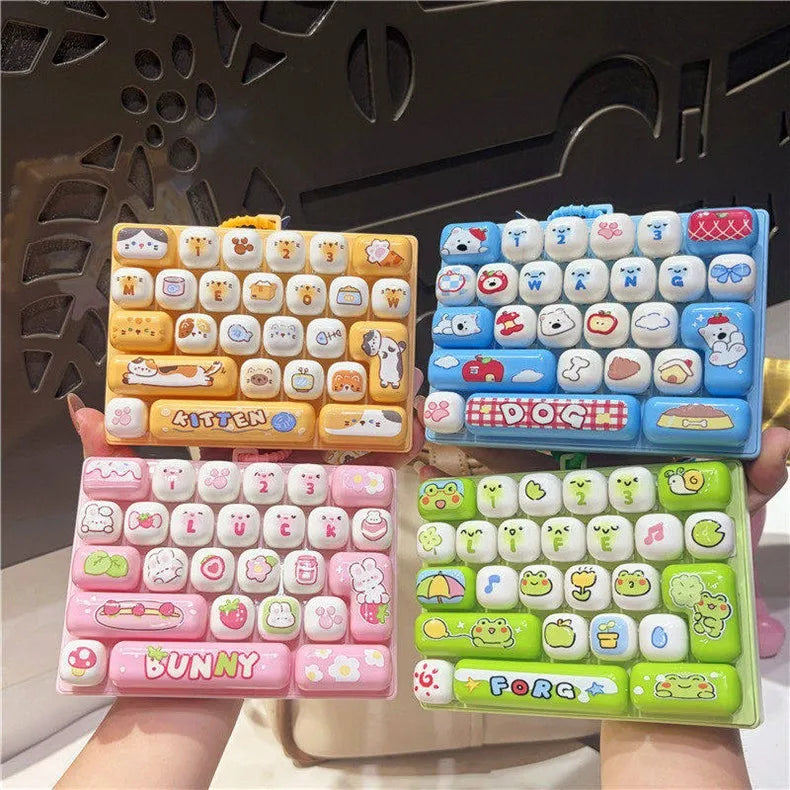 A set of colorful cartoon animal keycap keychains arranged in various layouts for stress relief.
