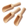 A set of three natural wooden scoop spoons with light brown handles and bowls.