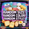 A colorful assortment of squishy toys including eggs, bread, and various silicone shapes for sensory play.
