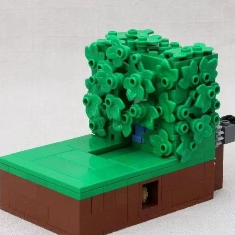 A green MOC building block set depicting Homer in the bushes scene.