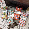 A collection of BAGGU miffy puffy glasses sleeves in various floral patterns displayed in a laptop case.