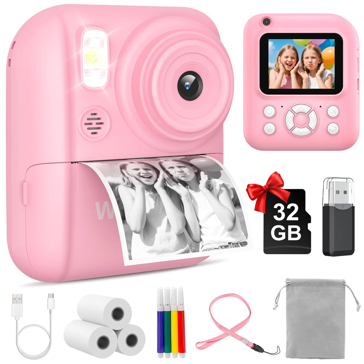 Pink instant print camera with a lens, film roll, and accessories like cables and pens.