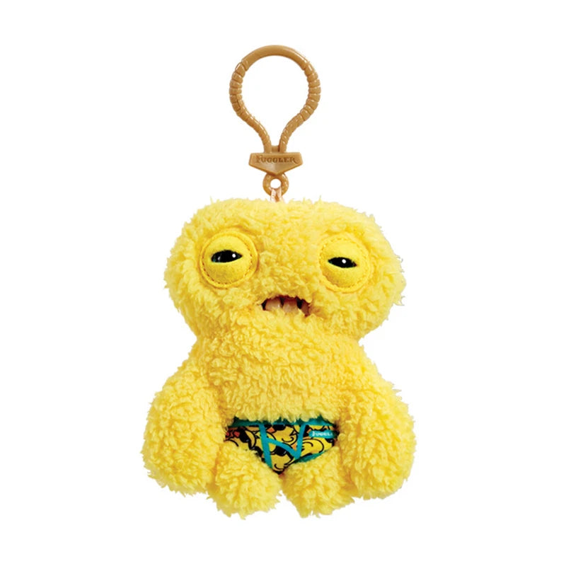 A yellow Fuggler funny plush monster keychain with a quirky rabbit design.