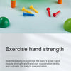 A collection of colorful hammer nails and a green ball on a light blue surface for fine motor skill exercise.