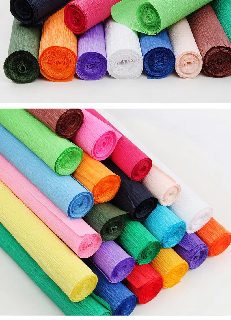 A collection of colorful crepe paper rolls in various shades including green, pink, yellow, blue, and orange.