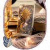 A set of 3D embossed foilings featuring a sun, moon, and stars on a card for journaling and scrapbooking