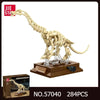A detailed model of a Tyrannosaurus Rex fossil built from light beige plastic blocks, displayed on a wooden base.