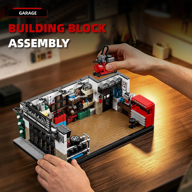 A hand is assembling a Building Block Assembly set featuring a vintage American garage structure with various components.