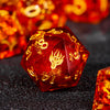 A close-up of a translucent red polyhedral die with gold markings, set against a dark background.