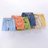 A collection of children's cotton-linen summer shorts in various colors including blue, orange, green, navy, beige, and yello