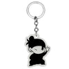 Black silhouette of a girl with short hair and closed eyes on a clear keychain ring.