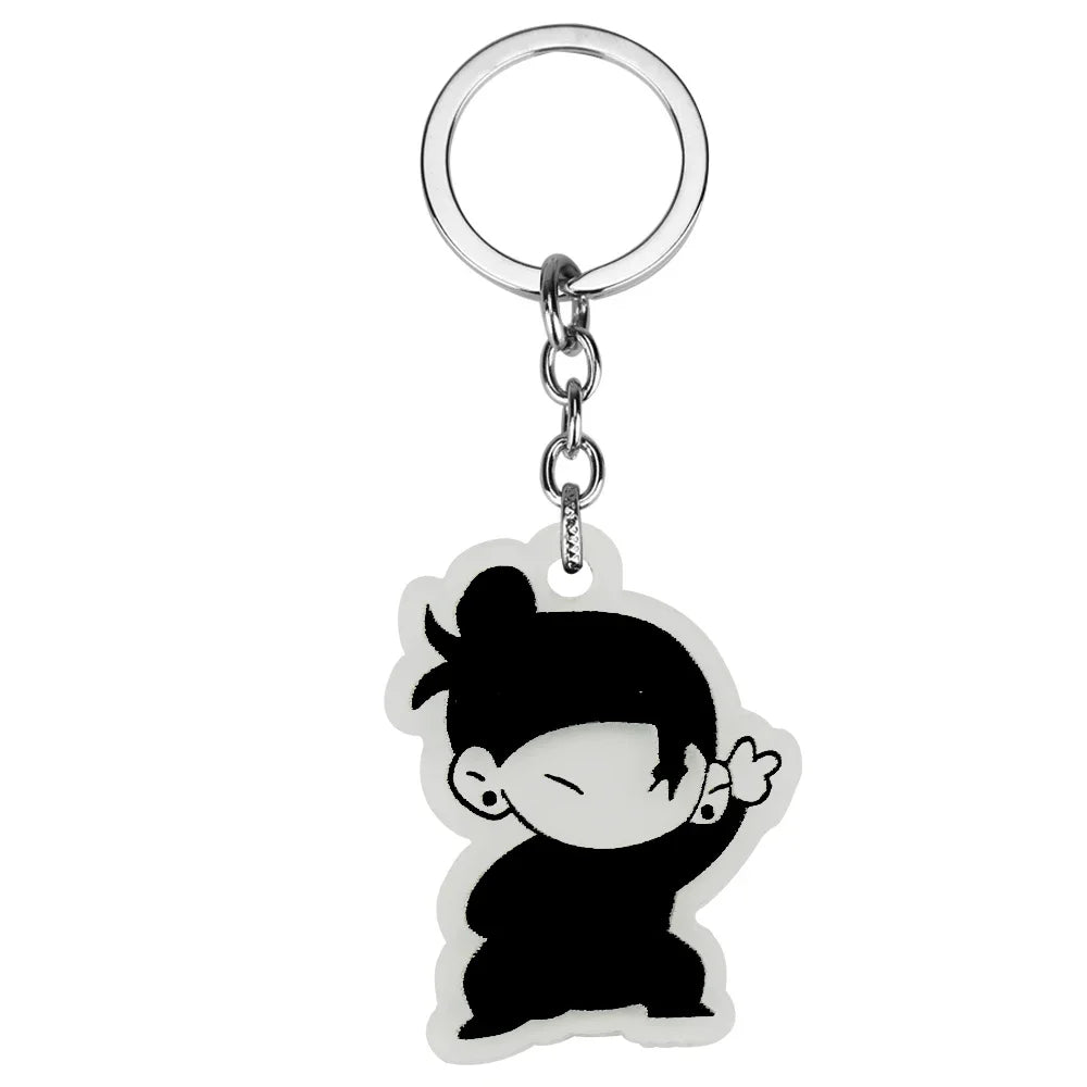 Black silhouette of a girl with short hair and closed eyes on a clear keychain ring.