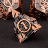 A close-up of a bronze metal die with the number one engraved on its face, set against a dark background.
