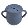 A gray BPA-free silicone snack cup with a lid and handle for babies and toddlers.
