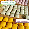 A collection of soft, tacky, pastel-colored sticky cubes and yellow squishy cubes for stress relief