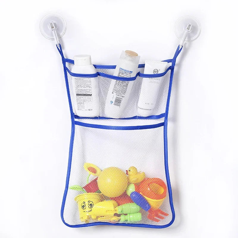 A mesh storage bag with suction cups holds various duck and frog toys for bathroom or shower use.