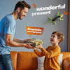 A man gives a child an exciting gift box featuring a wall-climbing RC gecko toy with glowing eyes.