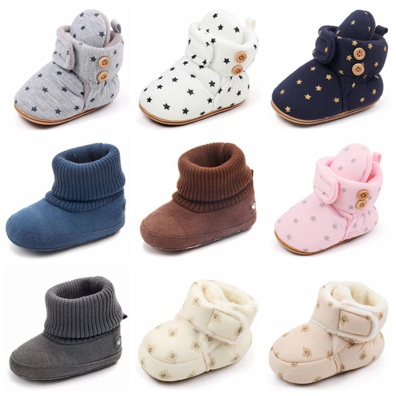 A collection of baby winter snow boots in various colors and patterns with fuzzy ball accents.