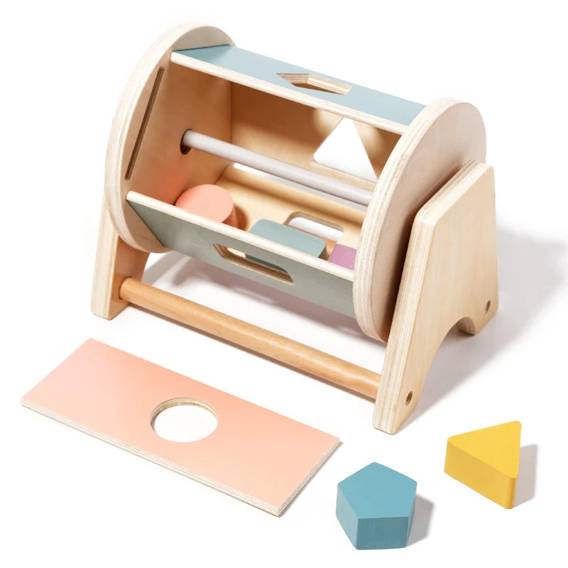 A wooden hand bell for sensory play with a light wood frame and colorful internal components.