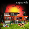 A model of a Vampire Villa building set featuring a modern house, trees, and various accessories on green grass.