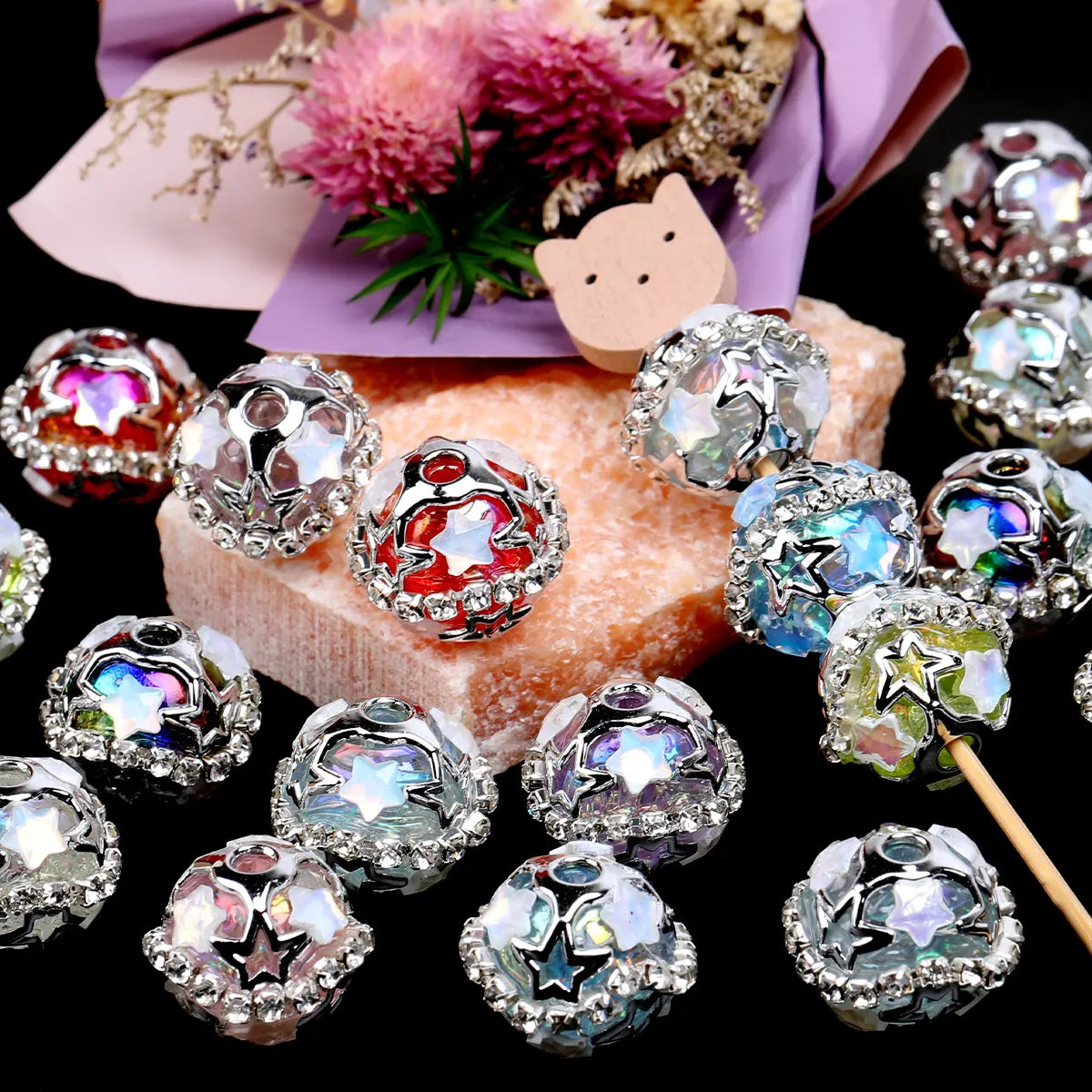 Silver star rhinestone acrylic beads for jewelry making displayed on a dark background