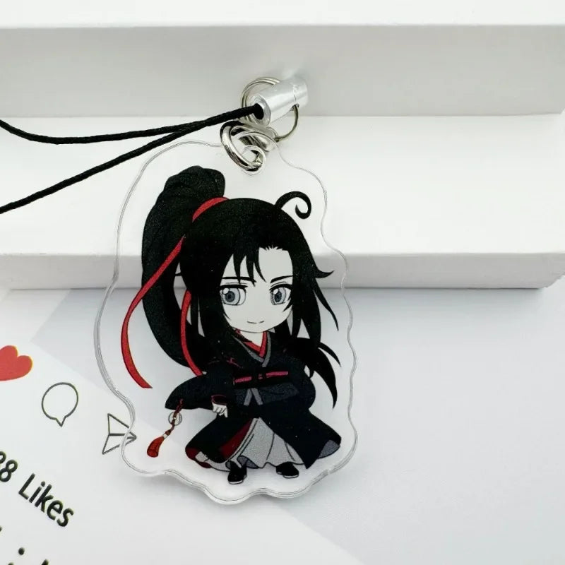A clear acrylic pendant featuring an anime-style character with black hair tied up in a ponytail and wearing dark clothing, a