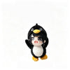 A cute plush toy of a penguin with black and white feathers and yellow beak.