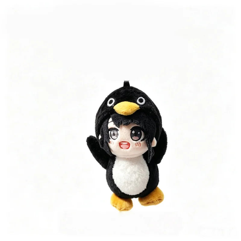 A cute plush toy of a penguin with black and white feathers and yellow beak.