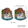 A silicone bead featuring a cartoon Santa hat and beard design in camel color.