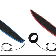 A black and blue mini finger surfboard skateboard toy with attached elastic bands.