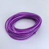 A coil of purple flexible silicone tinned copper wire with various AWG gauges.