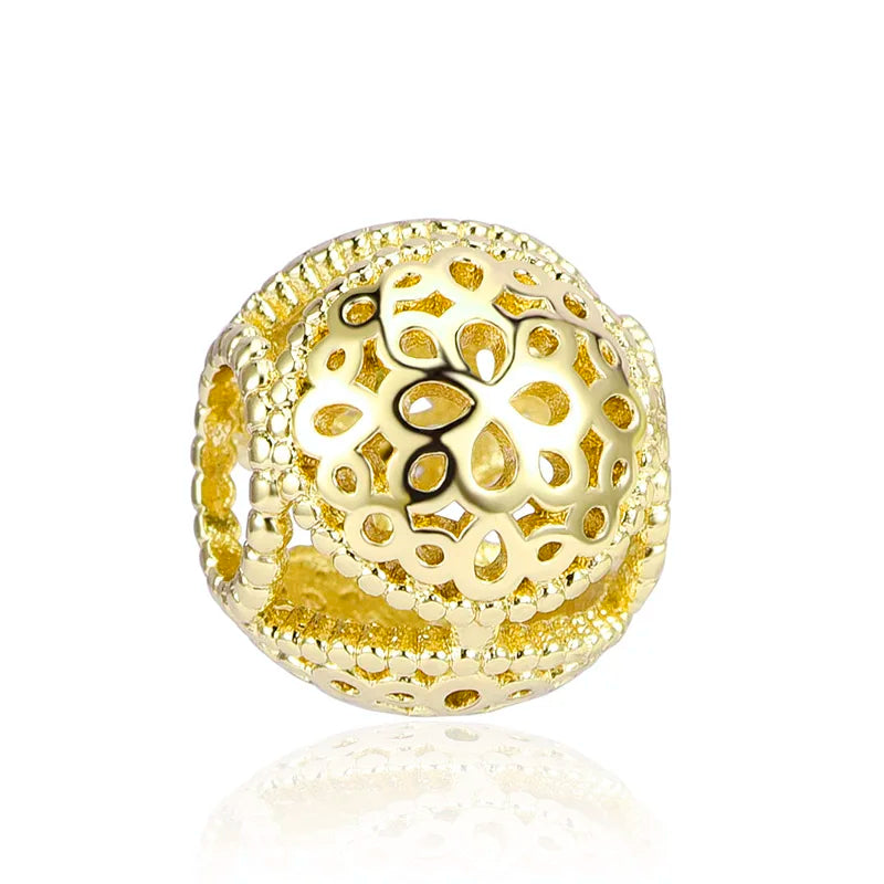 A gold-toned charm bracelet featuring elephant, key, butterfly, and heart pendants.