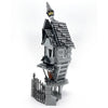 A gray LEGO building block set depicting a haunted house with a turret and surrounding fence.