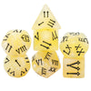 A set of seven yellow polyhedral dice showing Roman numerals and symbols for tabletop role-playing games