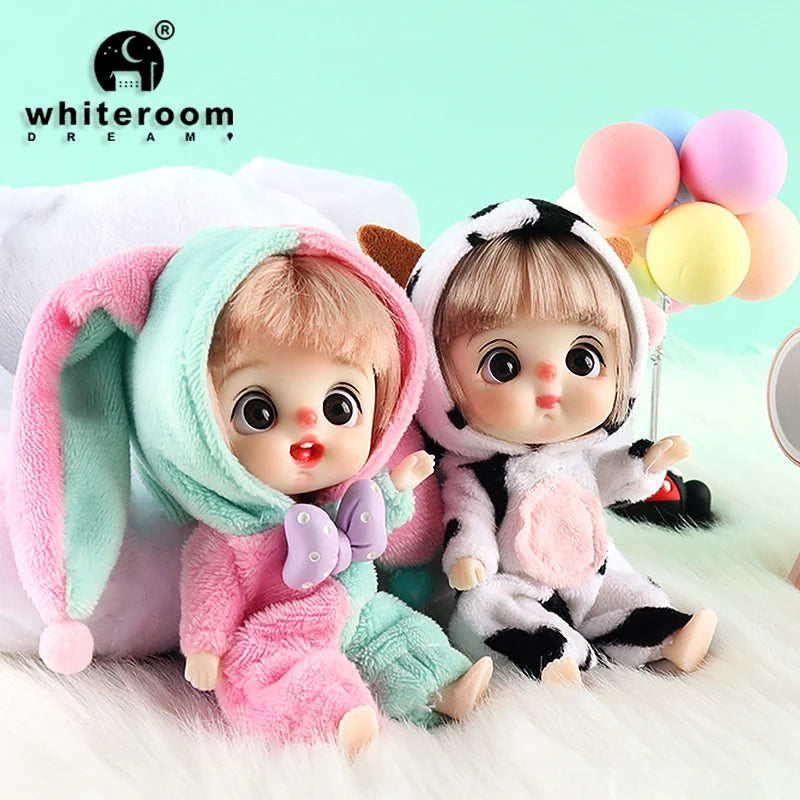 A pair of mini smile dolls with poseable joints and pink, white, and pastel colored balloons.