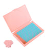 A pink diamond painting storage organizer box open to reveal a tray of blue beads.