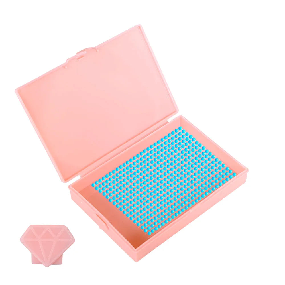 A pink diamond painting storage organizer box open to reveal a tray of blue beads.